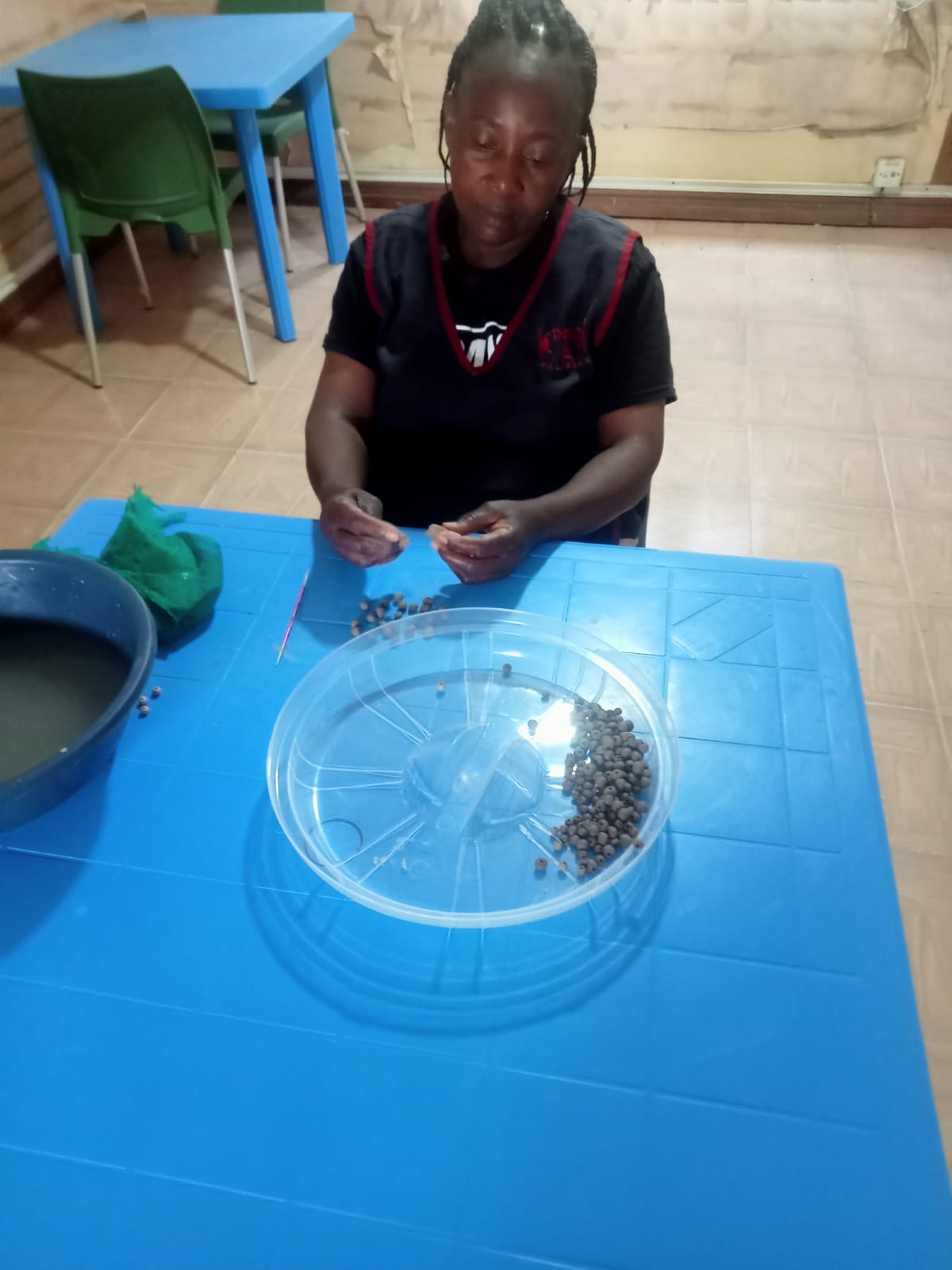 Artisans creating handmade clay beads